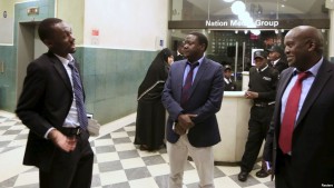 FILE - Editors of the Daily Nation, a leading Kenyan newspaper, speak at the main entrance of their premises in Kenya's capital Nairobi, Nov. 10, 2015 (Reuters).